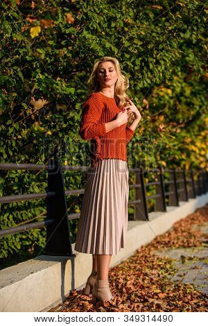 Autumn Fashion. Female Beauty. Femininity And Tenderness. Sunny Day With Fallen Leaves. Fall Fashion