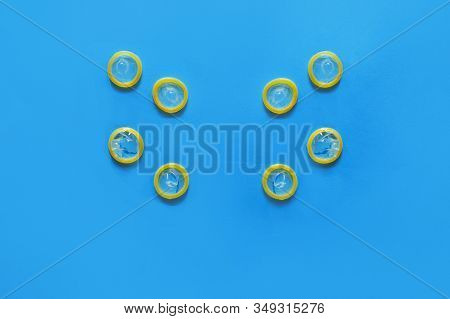Group Of A Condom On A Blue Background, Flat Lay