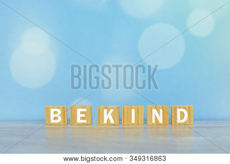 Inspirational Words On Wooden Blocks - Be Kind. On Vintage Soft Blue Bokeh Background. Kindness Moti