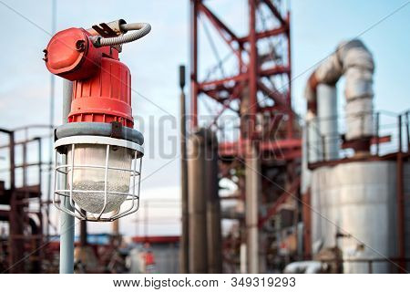 Lighting Mast With Lantern In Explosion-proof And Fire-proof Design Close-up Over Background Of Pipe