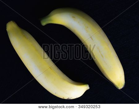 Fresh Cavendish Banana On Black Background. (fruit For Health)
