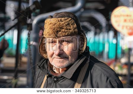 Belgrade, Serbia - 15.1.2020. Old Man Portrait On Market. Pensioner Lifestyle. Real Life Photo Of Ol