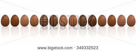 Chocolate Easter Eggs. Lined Up With Different Chocolate And Patterns, Dark, Light And Milk Chocolat