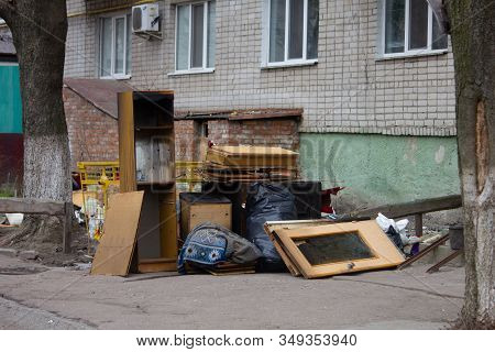 A Pile Of Household Furnishings, Damaged By Hurricane, Placed Curbside, Awaiting Trash Removal.