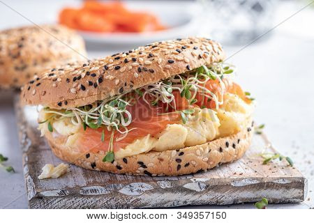 Breakfast Sandwich On Bagel With Salmon And Scrumbled Egg