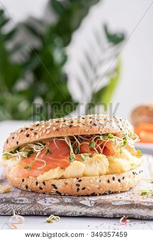 Breakfast Sandwich On Bagel With Salmon And Scrumbled Egg