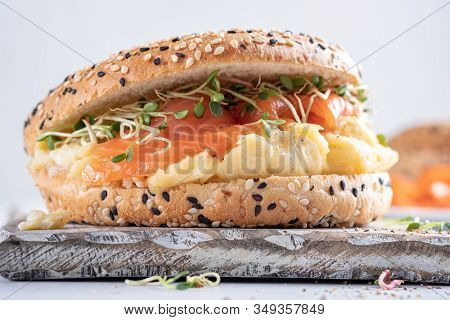 Breakfast Sandwich On Bagel With Salmon And Scrumbled Egg
