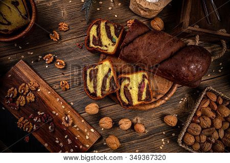 Tasty Braided Bun With Walnuts And Turkish Delight On A Wooden Background