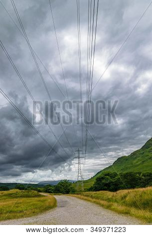 A Single Electricity Pylon Against The Backdrop Of Scottish Landscape In Glen Strae, Near Dalmally, 