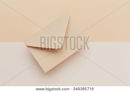Biege Envelope On The Biege Double Colored Background. Mail Concept
