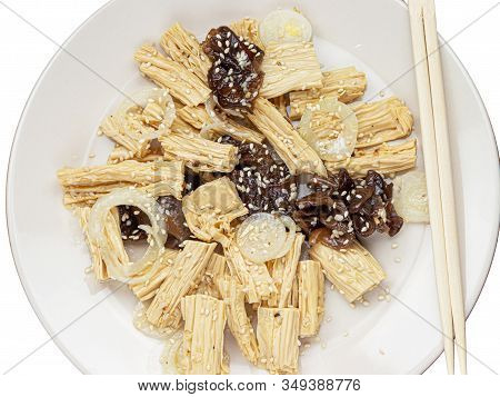 Close-up Spicy Chinese Or Korean Yuba Tofu Bamboo And Oyster Mushrooms On Wooden Background.