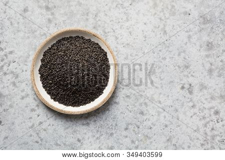 Basil Or Grain Seeds In Bowl Isolated On Grey Background. Scientific Name Is Ocimum X Citriodorum. T