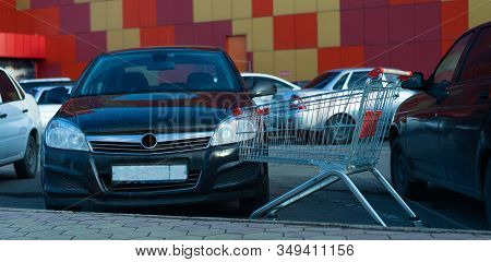 Shopping Trolley Standing On The Street.shopping Trolley Standing On The Street
