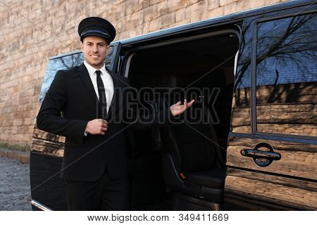 Professional Driver Near Luxury Car. Chauffeur Service