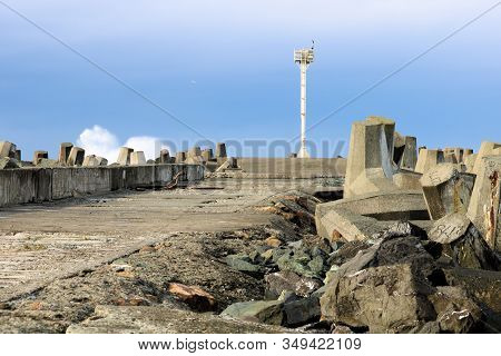 Dolos Concrete Barriers On The Side Of A Collapsing Pier Destroyed From Pacific Storms Taken At The 