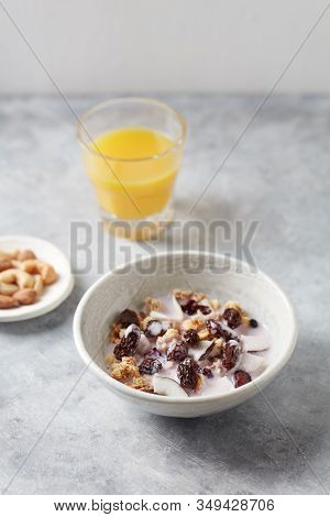 Bowl Of Granola With Nuts, Cranberry And Cocoanut. Concept For A Tasty And Healthy Meal. Stone Backg