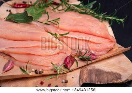 Raw sliced chicken meat close-up. Sotilissimo. Delicious dietary meat. Cooking,food of meat and fillets.Close-up view of raw, fresh, choped and sliced chicken meat.Sottilissime