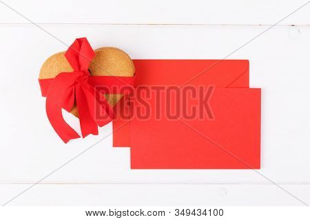 Heart Shaped Cookies With Red Ribbon And Red Mockup Greenting Card, On A White Backround. Simbol Of 