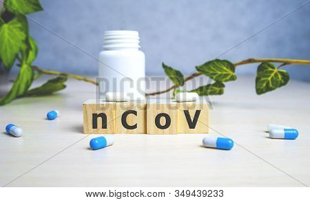 The Inscription 2019ncov On Wooden Cubes, Blue Background. Health Concept, Chinese 2019 Virus-ncov.