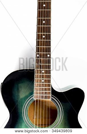 Classic Acoustic Guitar On A White Background, Close-up.