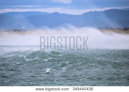 Large Waves Battering The Shore Including Spray Mist From Wind During A Pacific Storm Taken In The R