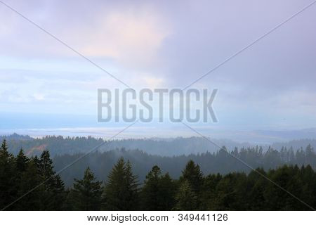 Storm Clouds Producing Rain Showers On Forested Hills In The Rural Northern California Coast Near Eu