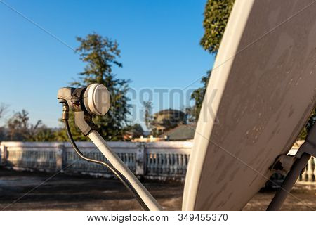 Lnb, Satellite Dish Over The Blue Sky In Background, Selective Focus.