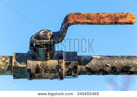 Water Pipe Value Over The Blue Sky Background.