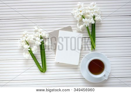 Spring Flat Lay.spring To-do List.white Blank Notebook, Cup Of Tea And Spring Flowers White Hyacinth
