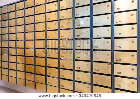 Rows Of Metallic Mailbox At Postal Room Inside Condominium Building
