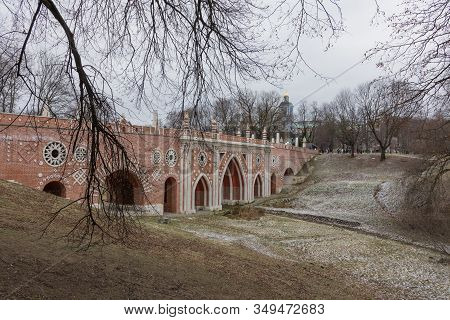 Moscow, January 07, 2020 Museum Reserve Tsaritsyno View Of The Brick Bridge, Photo Taken On A Cloudy