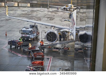 Istanbul Sabiha Gokcen Airport - February 2020. Loading Luggage To Aircraft On The Airfield