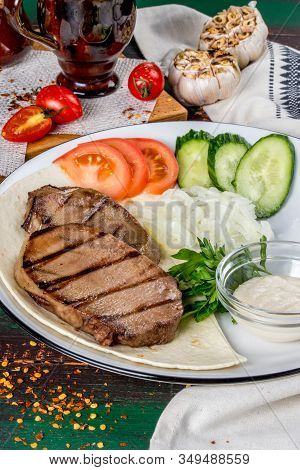 Cooked Veal Tongue With Fresh Vegetables. Shot In The Decor