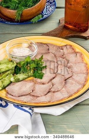 Cooked Veal Tongue With Fresh Vegetables. Shot In The Decor