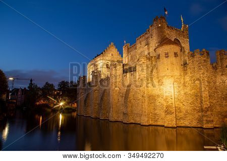 Granvensteen Castle In Ghent Belgium Lit Up At Night. Landscape Orientation