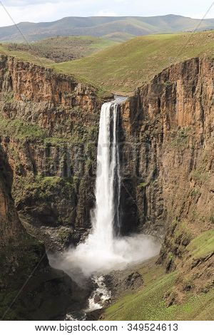 Close-up Of Stunning Waterfall Running Down A Steap Canyon