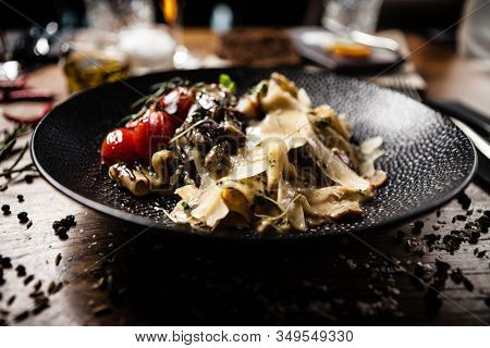 Black Angus pappardelle pasta with beef, champignon and parmegano cheese