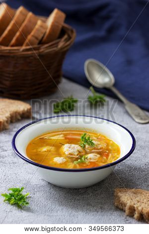 Dietary Soup With Meatballs, Potatoes And Noodles Served With Rye Bread With Bran. Childrens Menu.