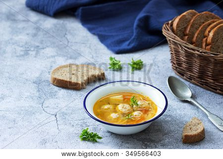 Dietary Soup With Meatballs, Potatoes And Noodles Served With Rye Bread With Bran. Childrens Menu.