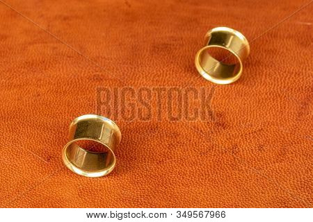 Group Of Two Whole Golden Plug On Cognac Leather