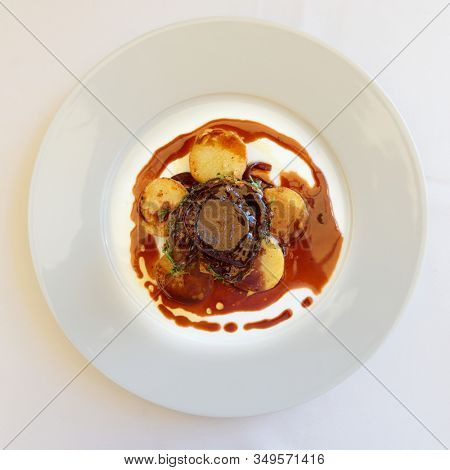 Fillet mignon steak with potatoes shot from above