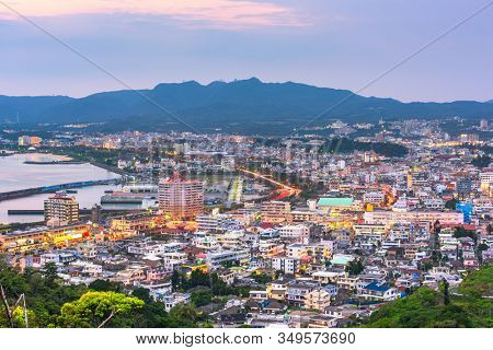 Nago, Okinawa, Japan downtown skyline at sunset.