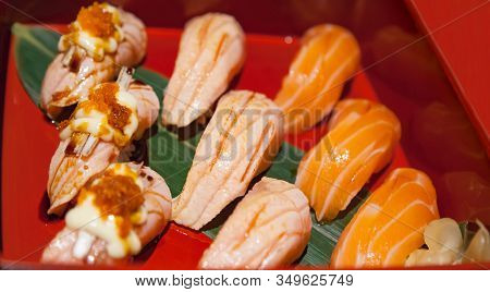 Japanese Fresh Fish Food Dish, Salmon Sushi And Salmon Aburi Assortment Decorating In Wooden Bento I