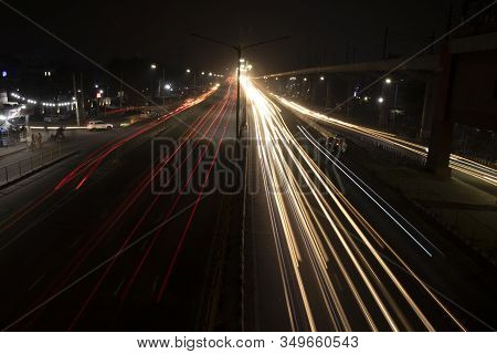 Speed Traffic Light Trails On Highway, Long Exposure, Urban Background And Dark Sky
