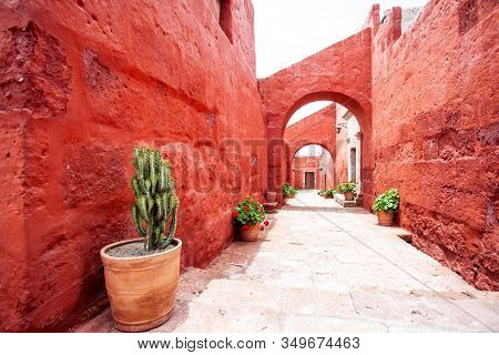 Arches On The Streets In The Monastery Of Santa Catalina, Arequipa, Peru, Cacti And Geraniums In Pot