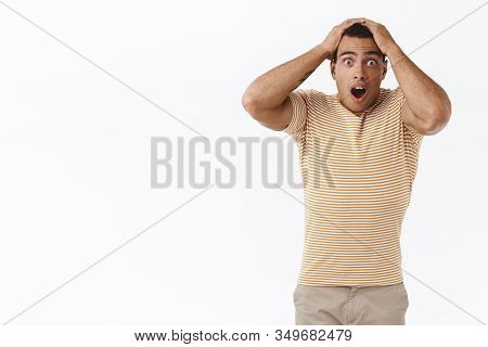 Anxious, Concerned Young Man Gambler Looking Troubled And Upset, Gasping Startled Looking Camera, Do