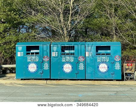 Woodbridge, New Jersey / United States - January 9, 2020: Three Clothing And Shoes Donation Bins Loc