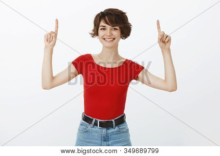 Morivated Good-looking Energized Cheerful Woman Short Haircut Raise Hands Pointing Up Promote Top Ad