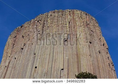 The Spectacular Vertical Rock Columns That Form Devils Tower National Monument In Wyoming Against A 