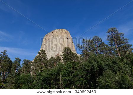 The Spectacular Vertical Rock Columns That Form Devils Tower National Monument In Wyoming Against A 